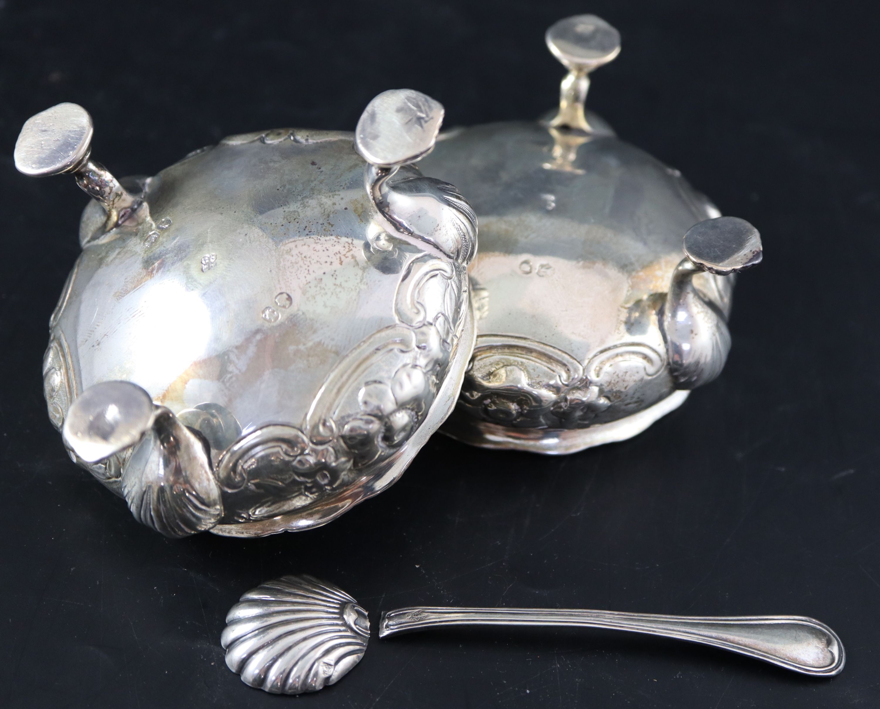 A pair of Victorian embossed silver bun salts, 8.5oz.